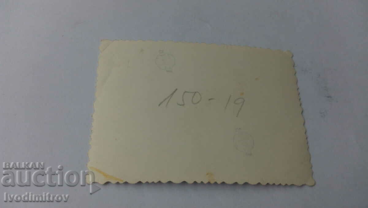 Photo Two women and a baby in front of the People's Teacher store with price 2.35 BGN | € 1.20