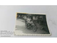 Photo Children with a retro motorcycle on the street