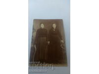 Photo Two women in black dresses