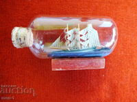 Ship a scaled-down copy of a ship in a bottle