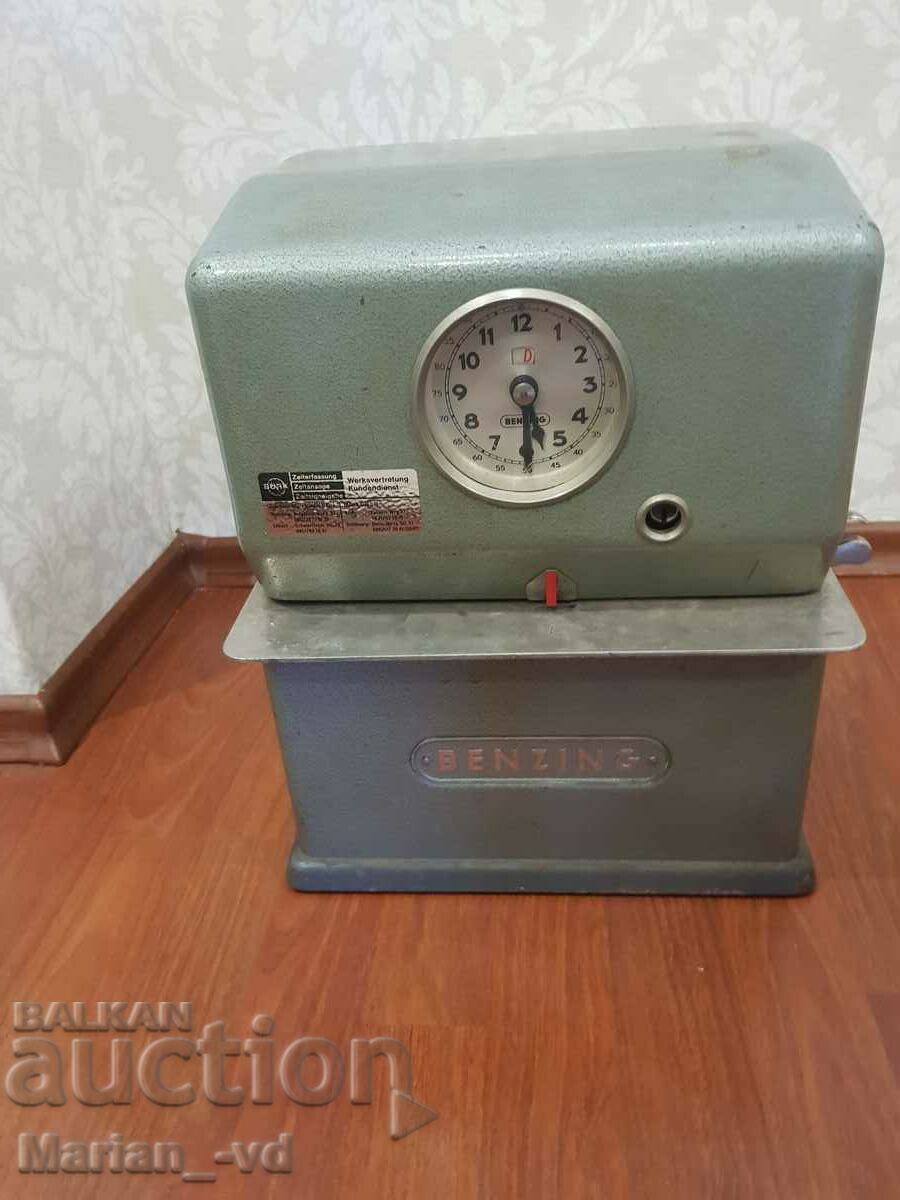 Old machine for attendance at a factory with a watch