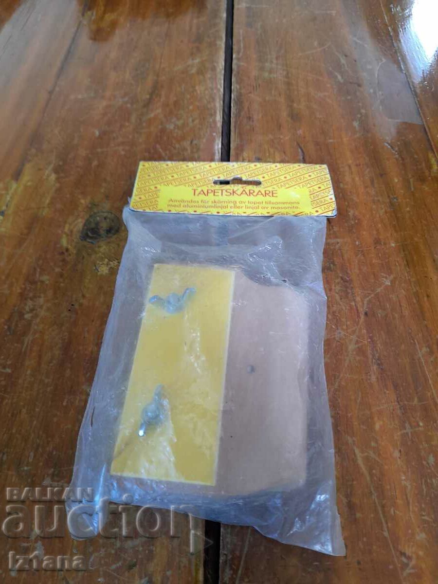 An old tool, a device for gluing wallpaper An old tool, a device for gluing wallpaper