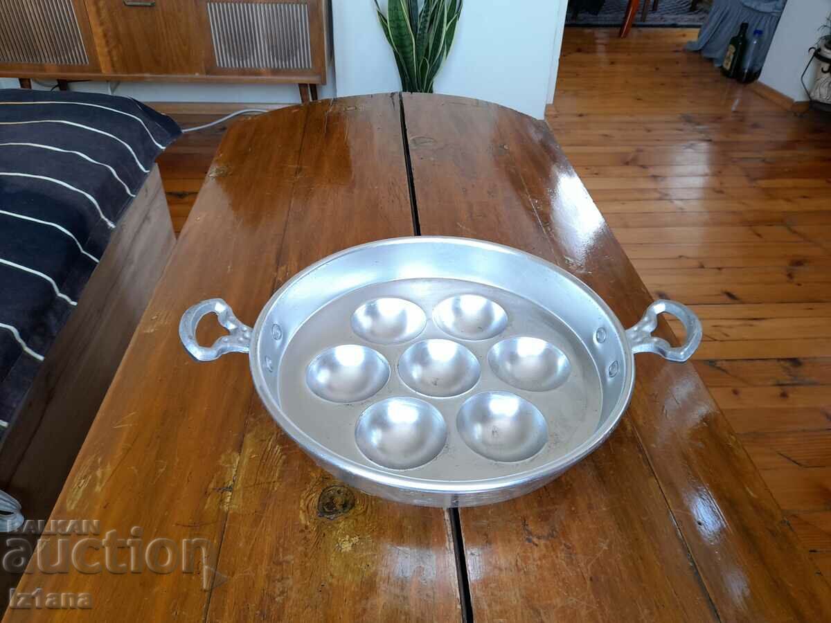 Old aluminum egg pan