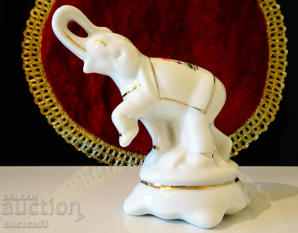 Porcelain salt shaker, Elephant figure, gold.