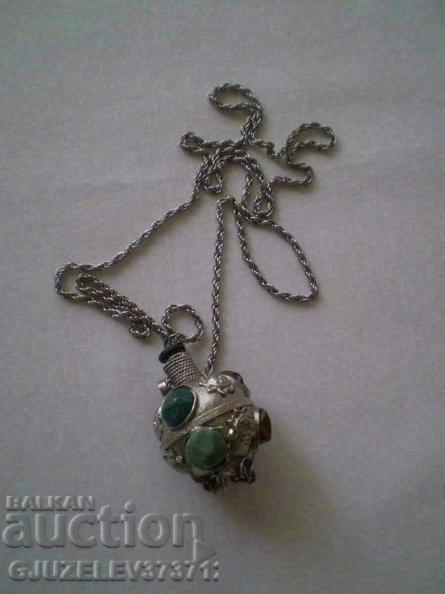 Collectible perfume bottle inlaid with stones. Collectible perfume bottle inlaid with stones.