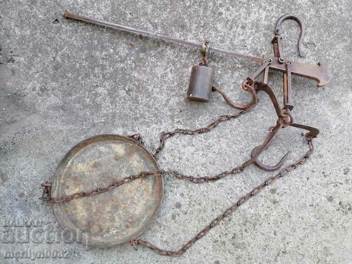 An old scale with an iron bowl, a mace, a wrought-iron scale