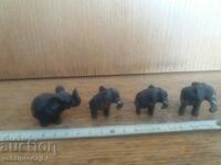 Lot of 4 small wooden elephants