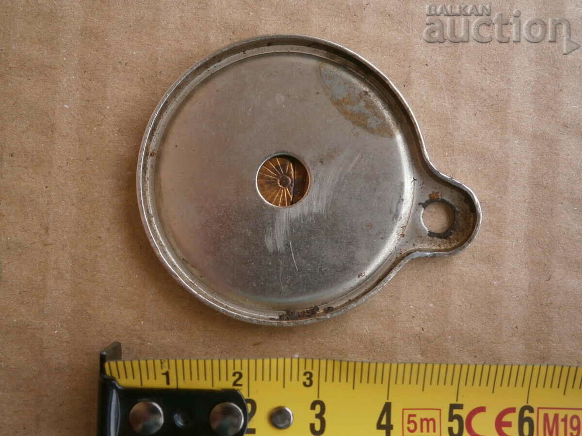 Delivery of Old plate from a sewing machine USA emblem Delivery of Old plate from a sewing machine USA emblem