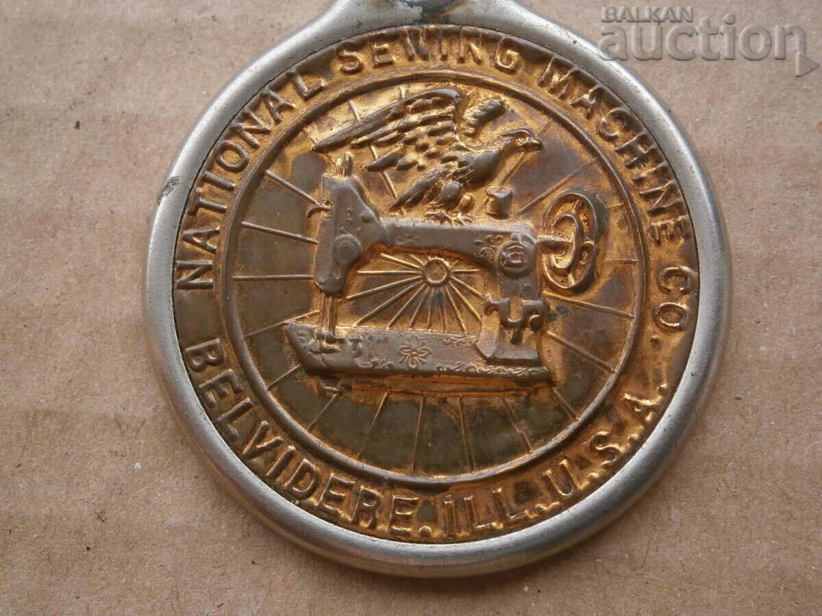 Old plate from a sewing machine USA emblem - 7 Old plate from a sewing machine USA emblem - 7