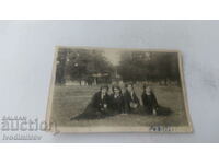 Photo Four schoolgirls sitting on the lawn 1931