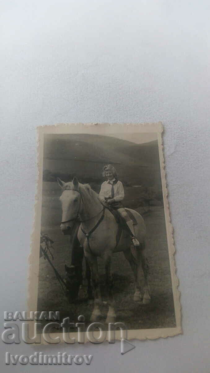 Φωτογραφία Κορίτσι σε ένα άλογο