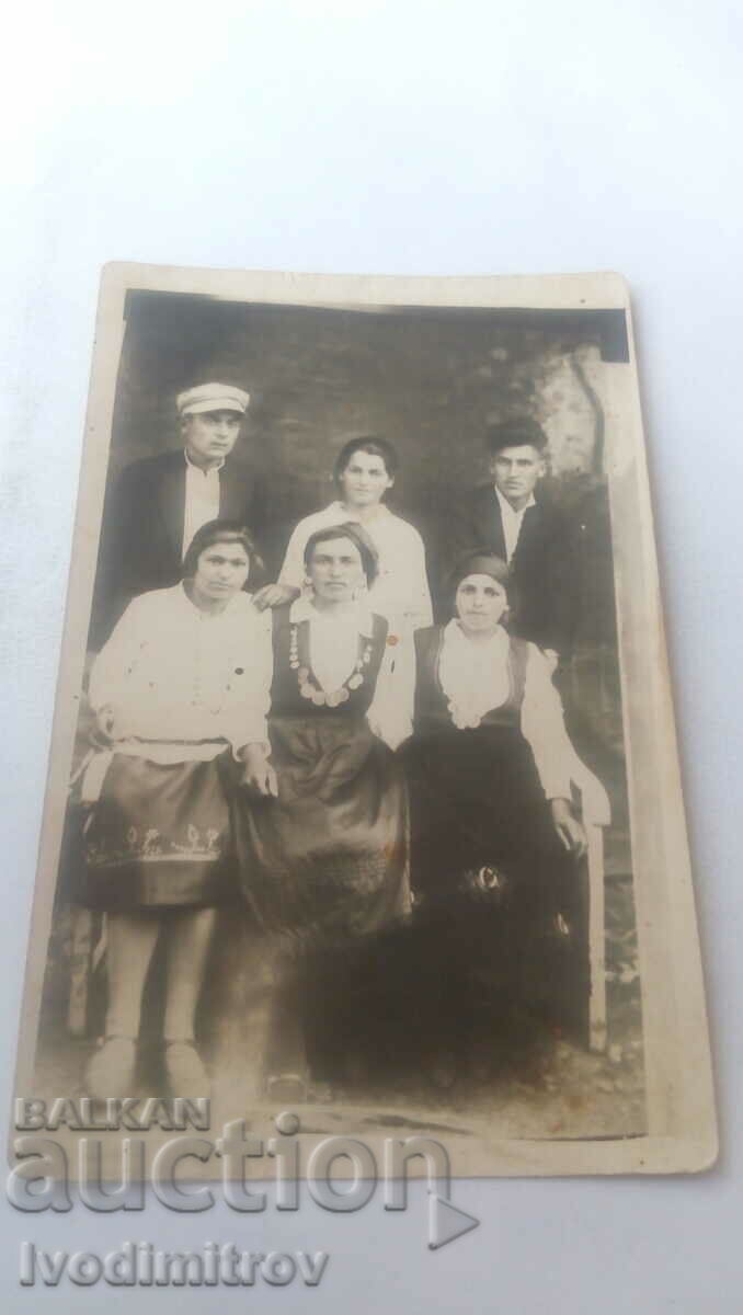Photo of two men and four women