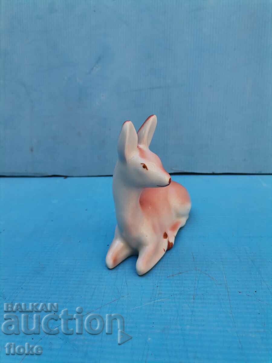 Auction An old porcelain statuette Auction An old porcelain statuette