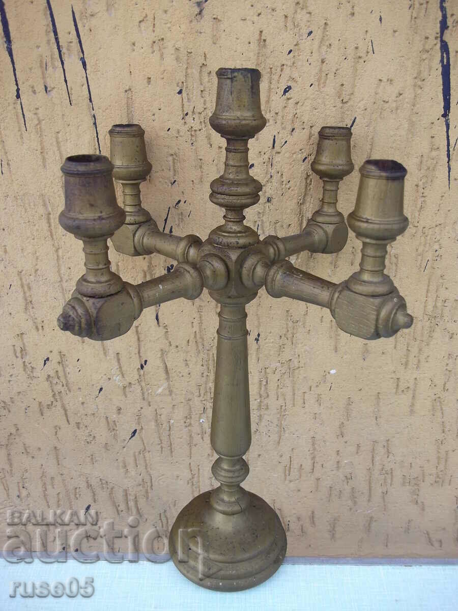 Old wooden candlestick for five candles