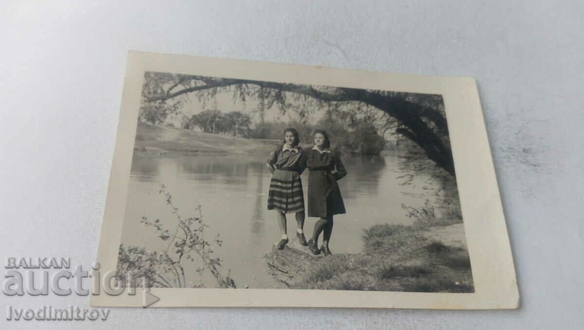 Picture Two young girls by the river