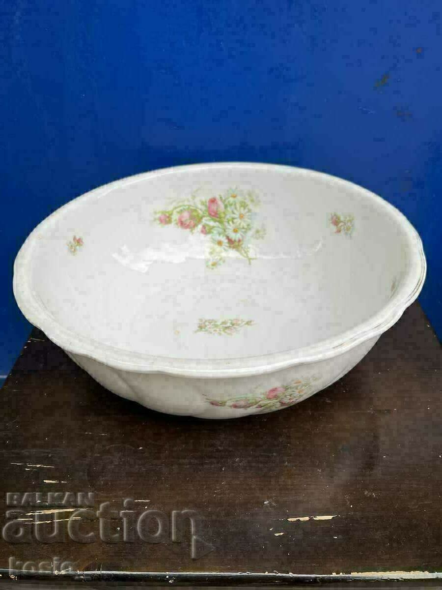 A large old porcelain basin