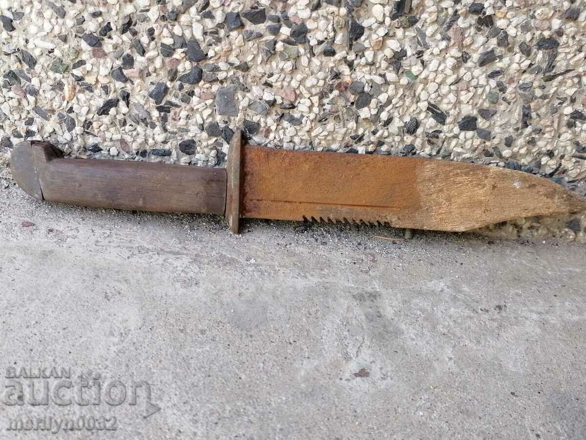 Delivery of Old knife with a saw on the blade Delivery of Old knife with a saw on the blade