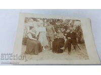 Photo A male officer and three females in the garden