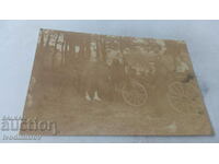 Photo Two men and three young women with a carriage 1918