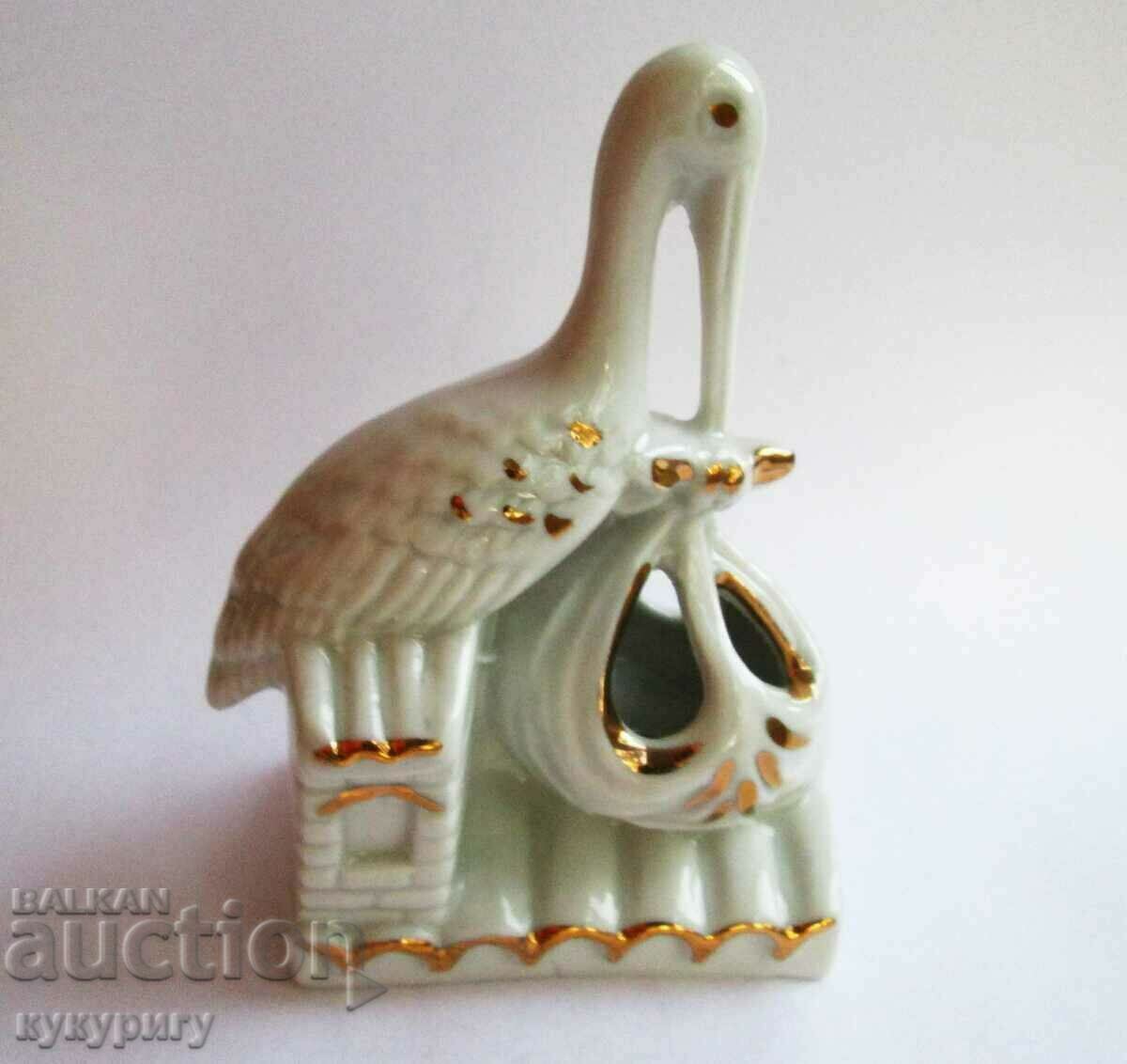 Old NRB porcelain statuette figure Stork carrying a baby