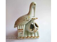 Old NRB porcelain statuette figure Stork carrying a baby