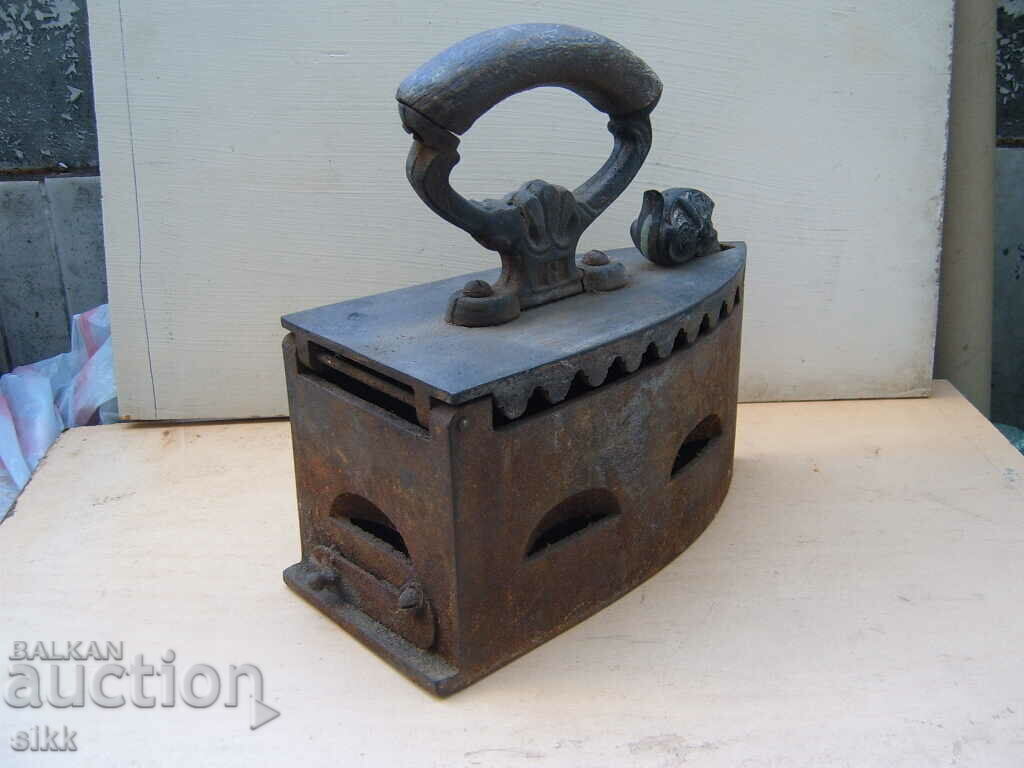 Auction  Iron on charcoal