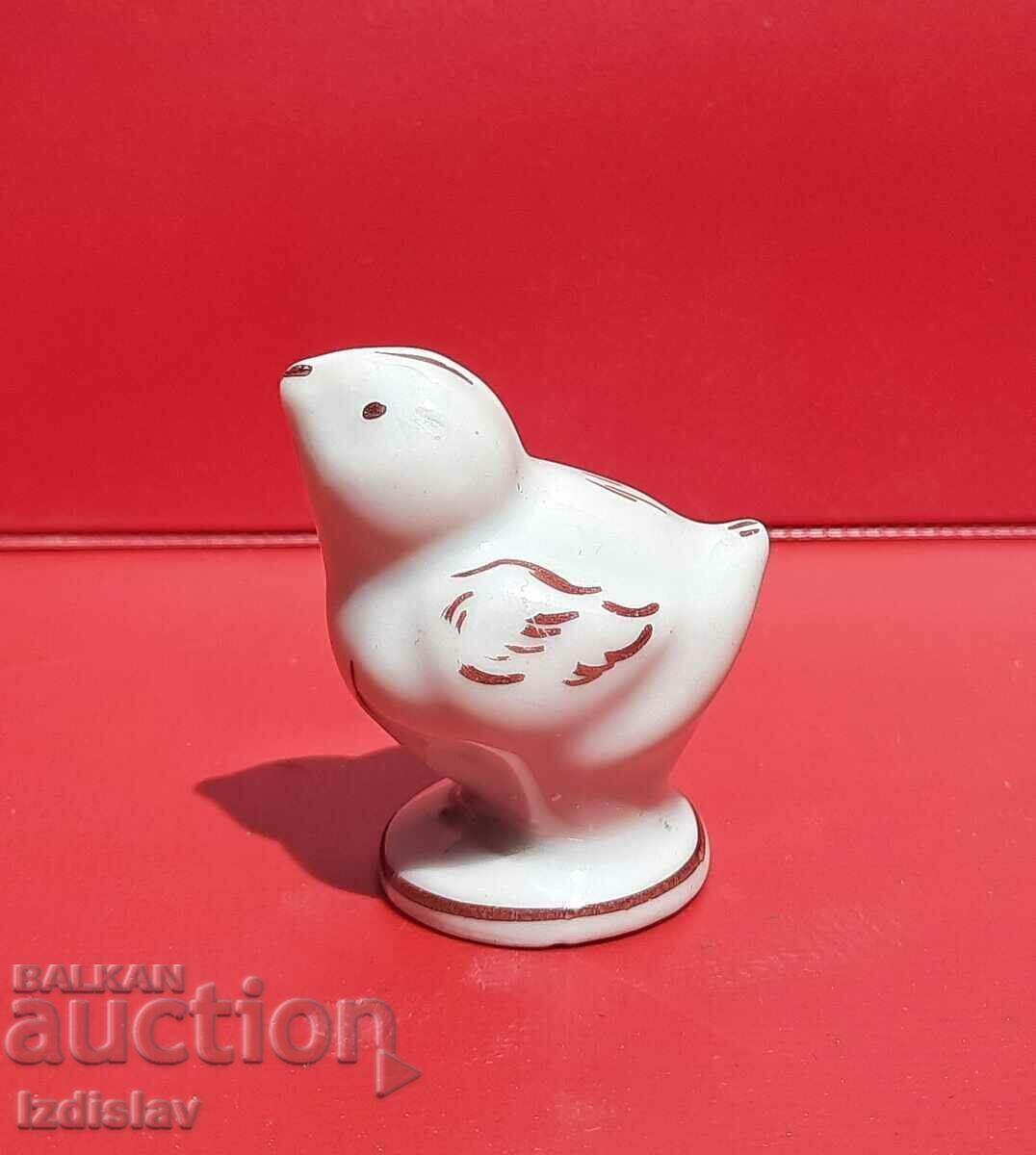 Old porcelain bird figurine