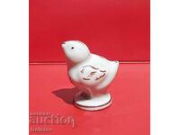 Old porcelain bird figurine