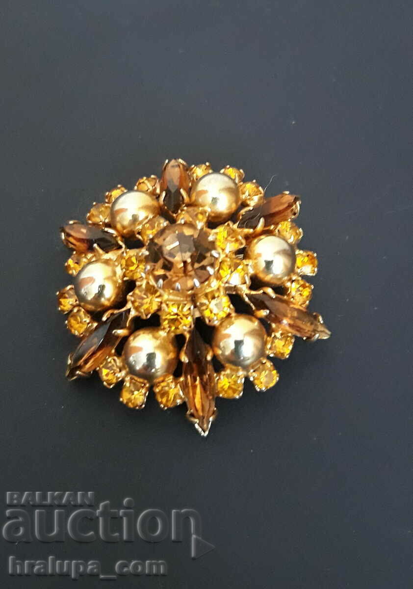 An old brooch with crystals