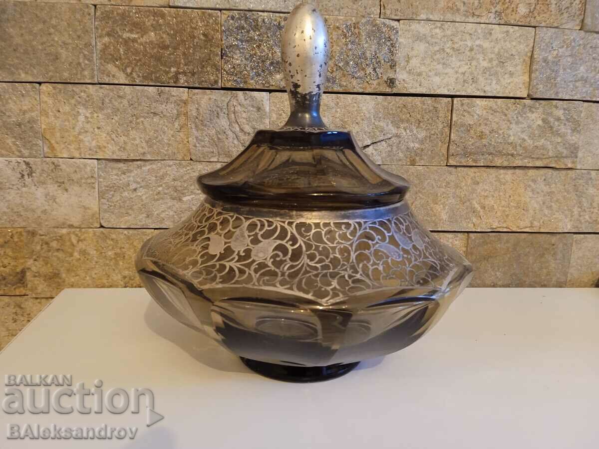 A large unique sugar bowl with silver fittings