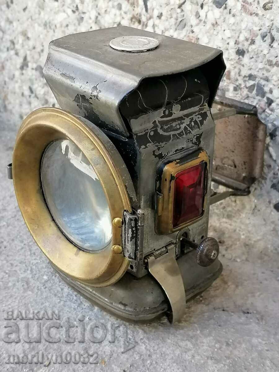 Old German lantern headlight of a bicycle lamp from a wheel