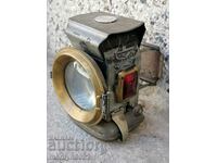Old German lantern headlight of a bicycle lamp from a wheel