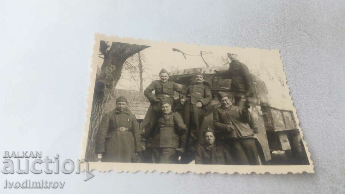 Photo Soldiers on a vintage military truck