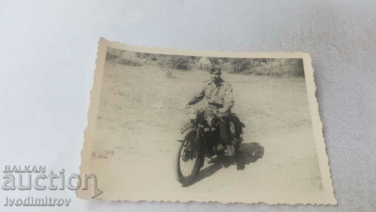 Photo Officer with a vintage motorcycle