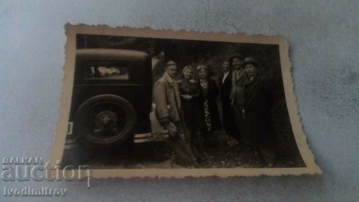 Photo Company next to a retro car