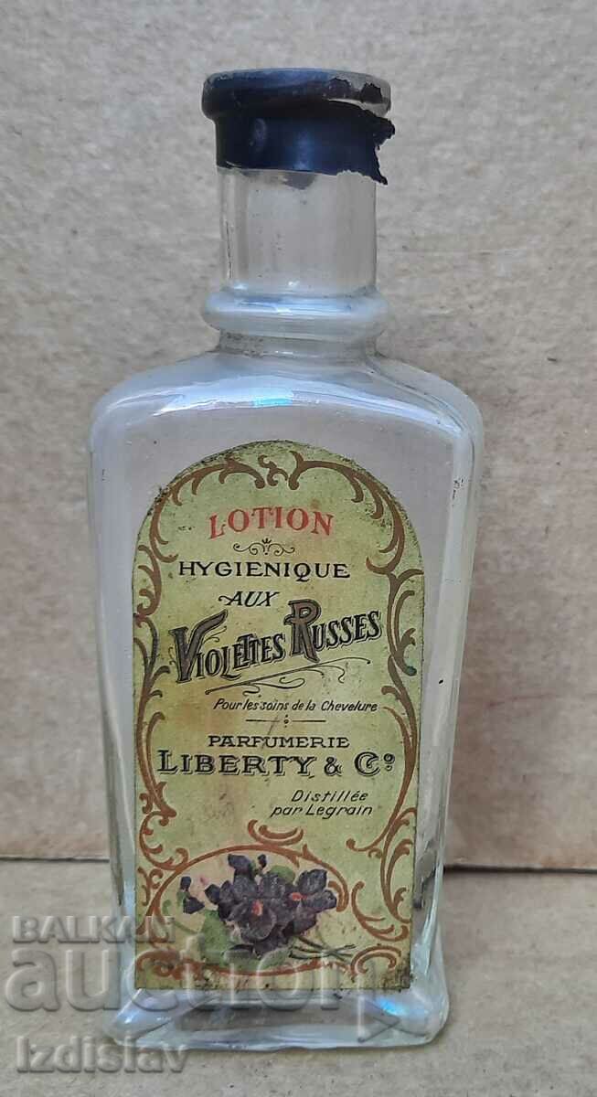 Sticla veche de sticla cu eticheta originala