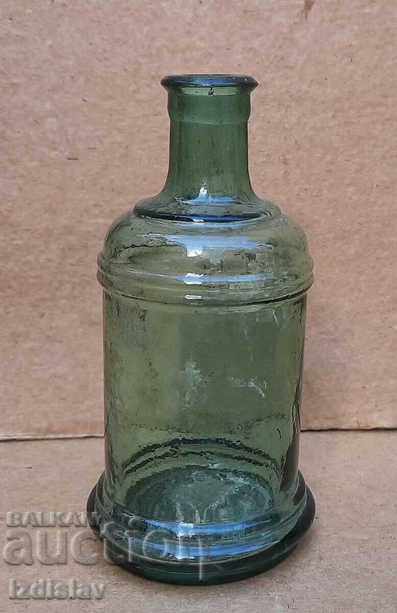 Antique glass bottle part of a collection
