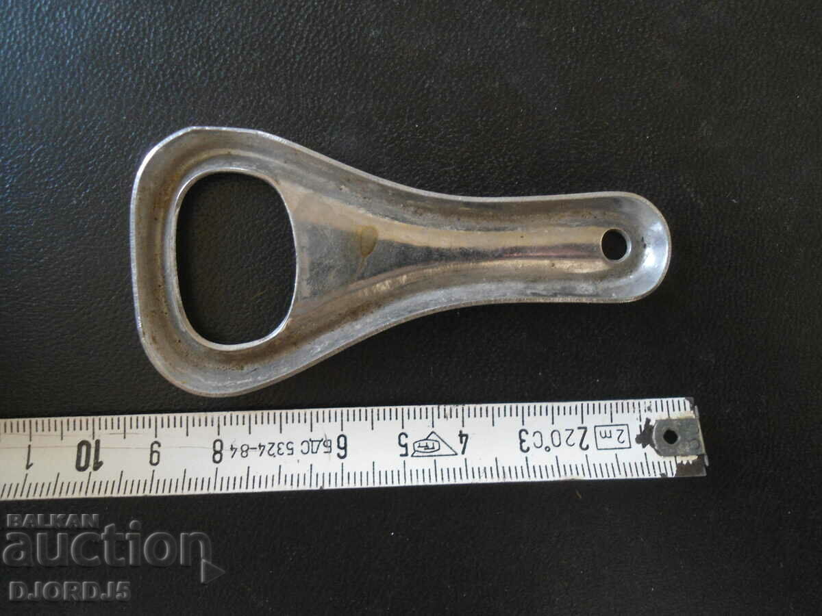Delivery of Old metal bottle opener, marking Delivery of Old metal bottle opener, marking