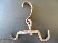 An old forged hook, a crown