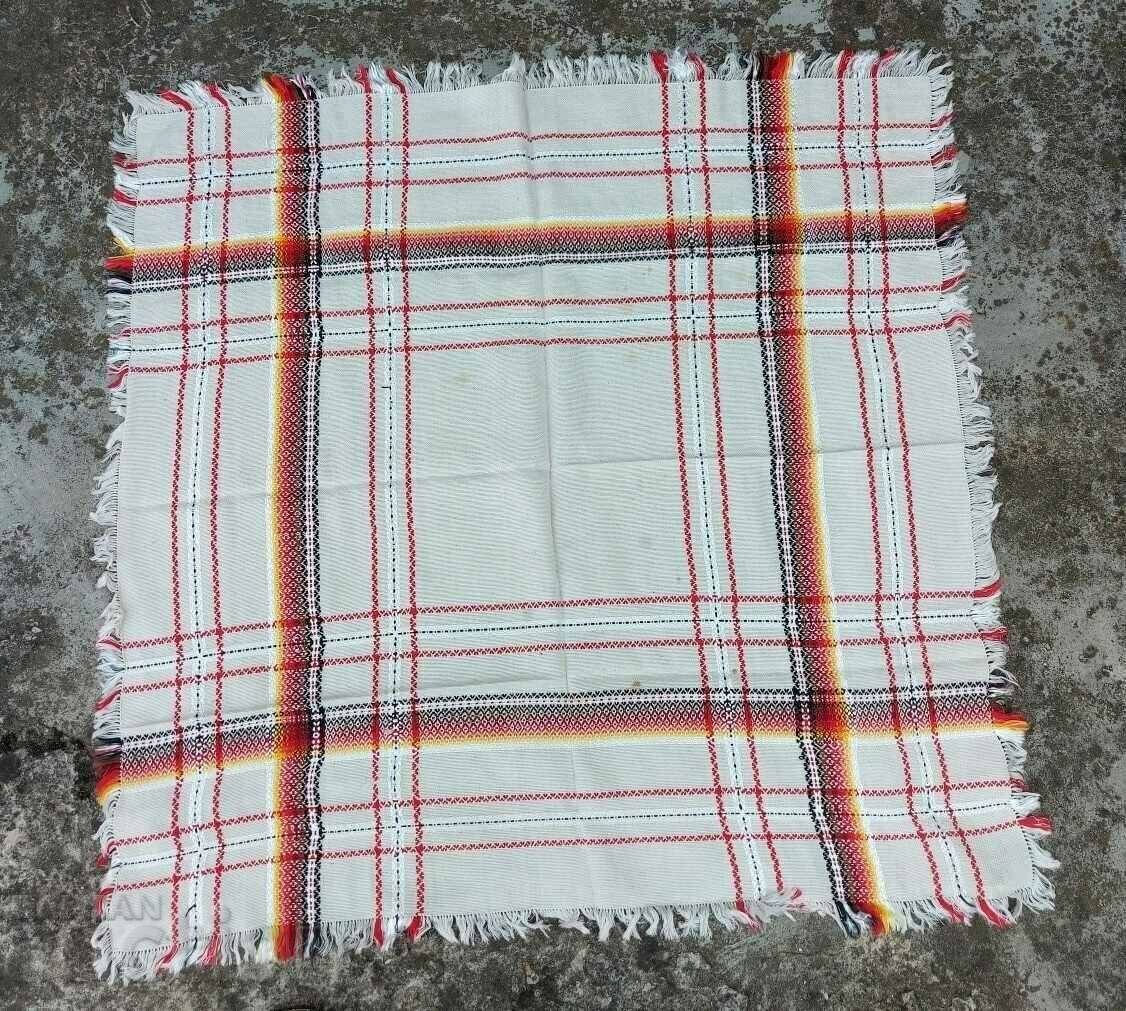 AN OLD ETHNIC CHECKED HOUSEHOLD ROOF HAS SPOTS AN OLD ETHNIC CHECKED HOUSEHOLD ROOF HAS SPOTS