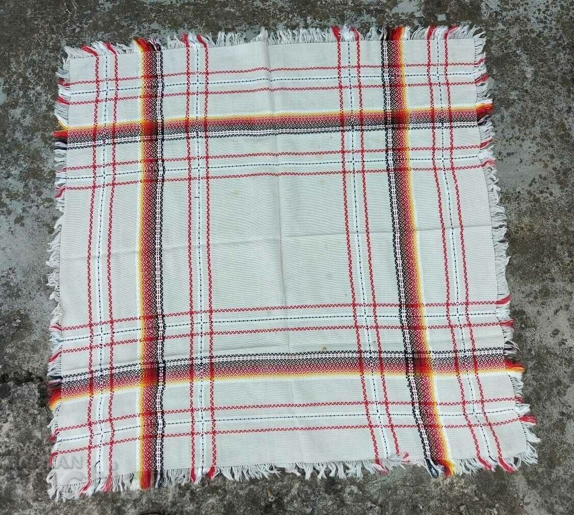 AN OLD ETHNIC CHECKED HOUSEHOLD ROOF HAS SPOTS