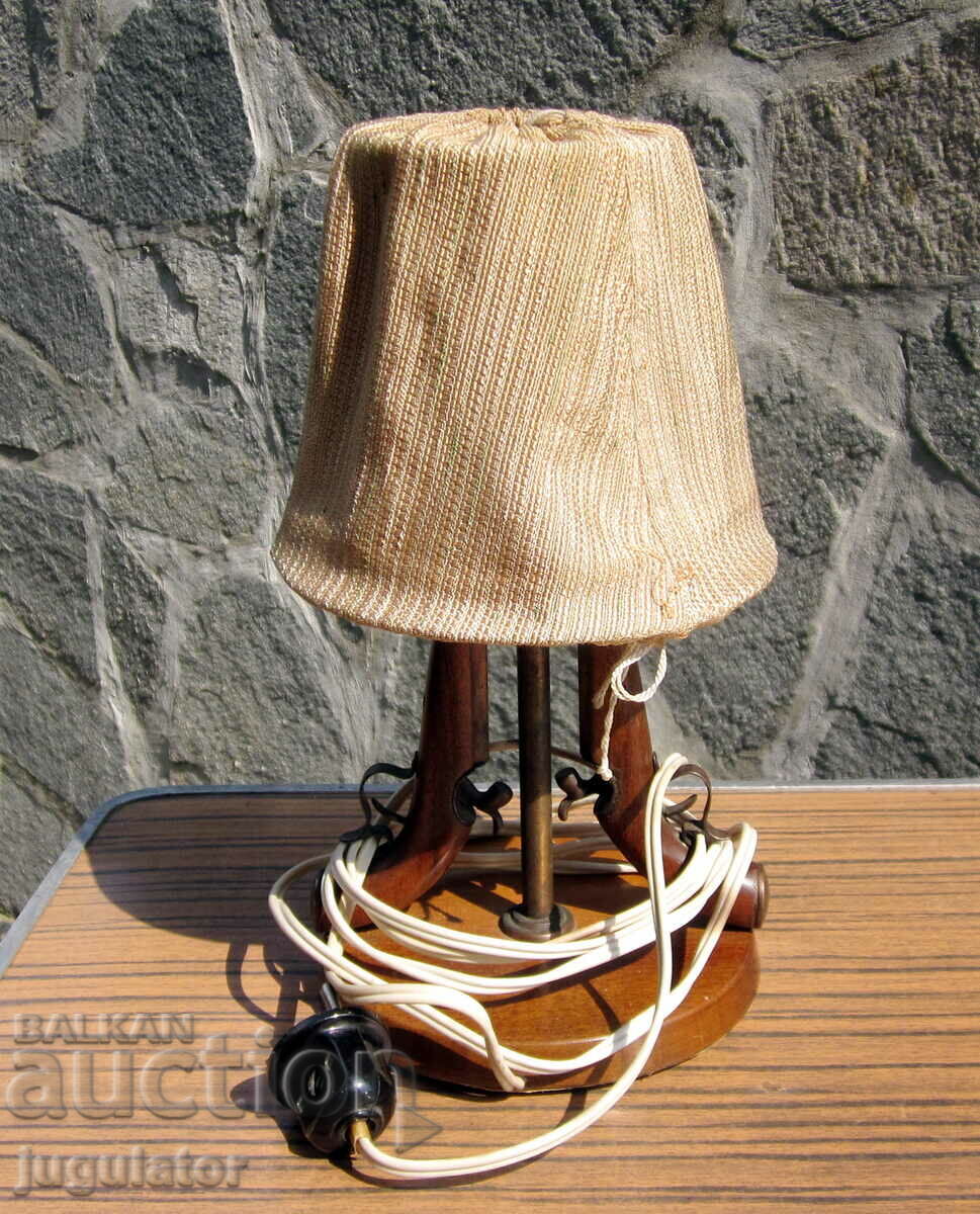 Auction old table lamp with flintlock guns military motif Auction old table lamp with flintlock guns military motif