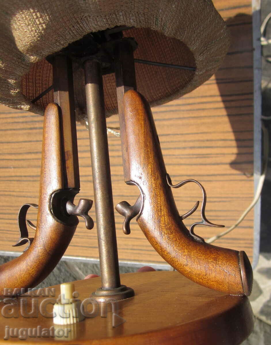 Delivery of old table lamp with flintlock guns military motif Delivery of old table lamp with flintlock guns military motif