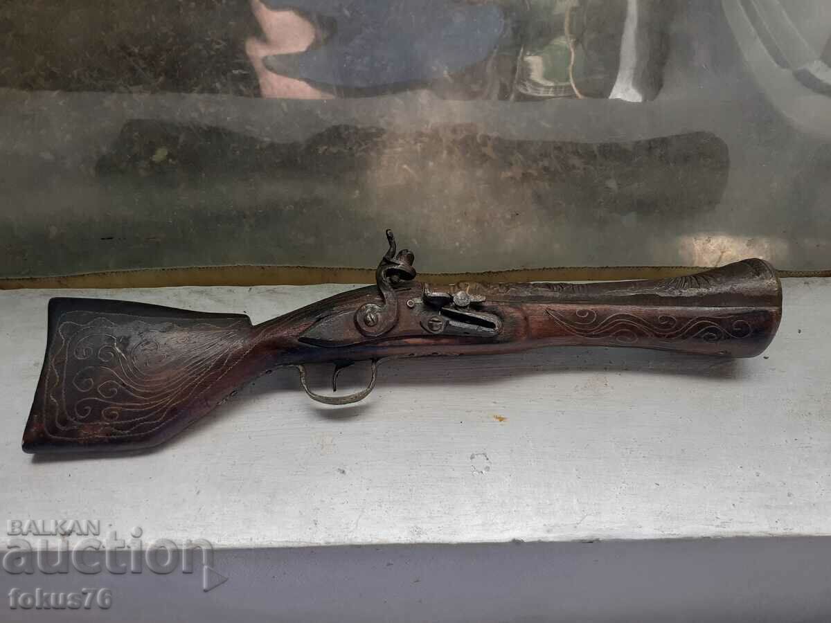 Old fine flintlock trombone with inlays on the butt in working order