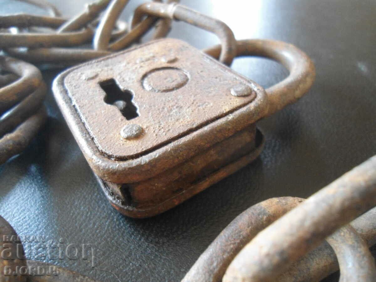 Auction  An old padlock with a chain