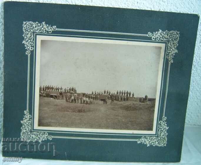 Large old photo cardboard officers, soldiers on the battle line