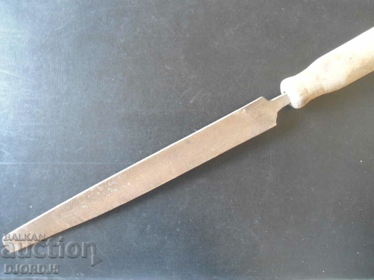 Old hacksaw, markings, wooden handle