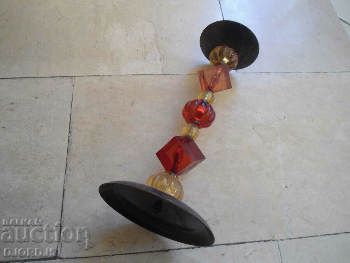 Delivery of An old metal candleholder Delivery of An old metal candleholder