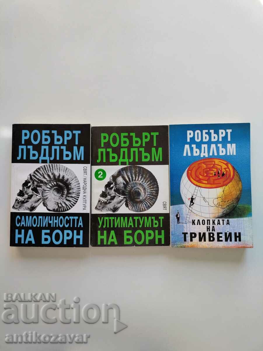 Three books by Robert Ludlum (thrillers)