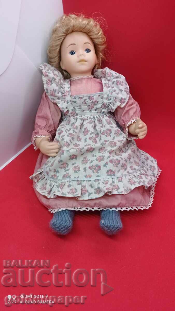 Porcelain doll sitting